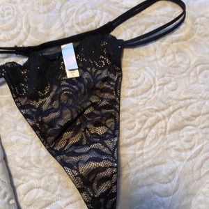 Victoria’s Secret thong. Sz L. Black lace with nude underlining